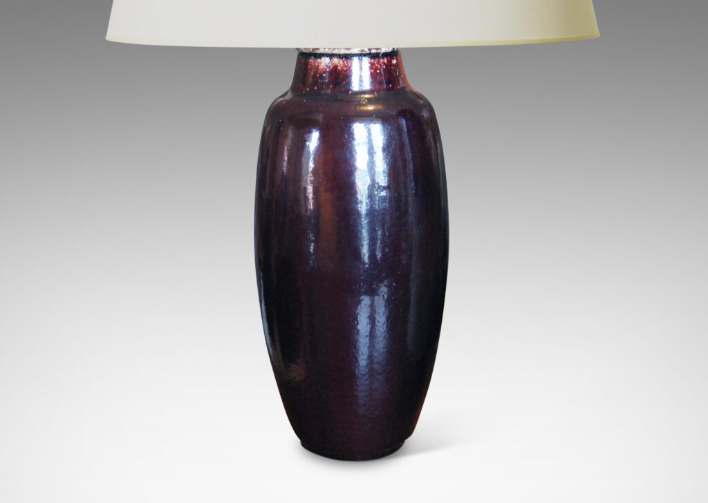 Gallery BAC apering oval form with arced neck in stoneware with a rich deep oxblood glaze