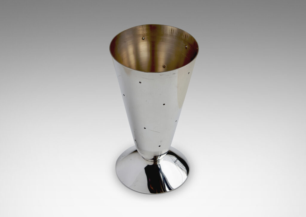 Gallery BAC combination vases / candlesticks each consisting of a conical form mounted to a modeled disk, which when set on the cone end is a candlestick with the disk functioning as a bobeche around a socket, and when set on the disk end is a vase