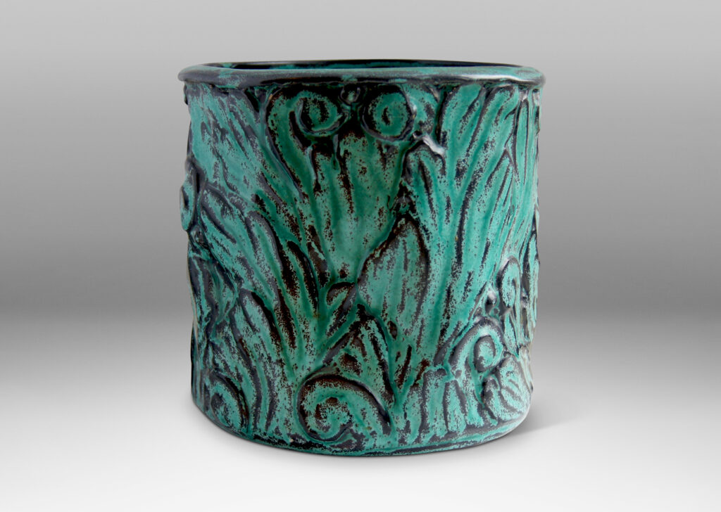 Gallery BAC hand-formed and carved in earthenware glazed to great effect in teal layered with black to add shows and depth