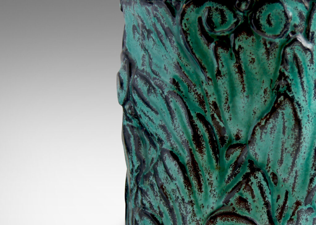 Gallery BAC hand-formed and carved in earthenware glazed to great effect in teal layered with black to add shows and depth