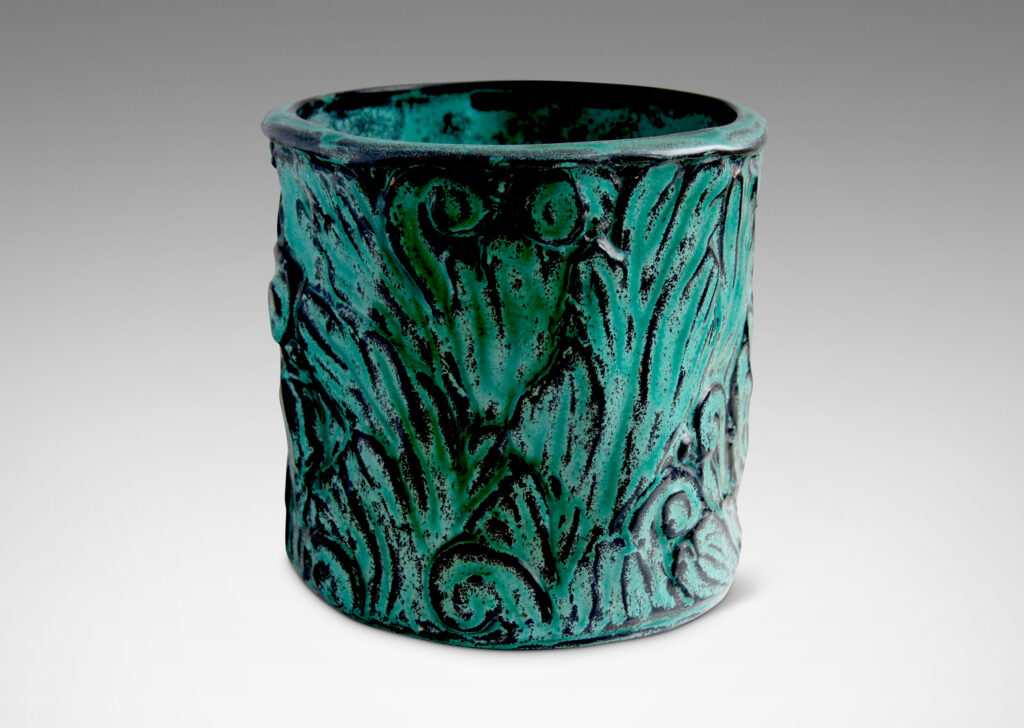 Gallery BAC hand-formed and carved in earthenware glazed to great effect in teal layered with black to add shows and depth