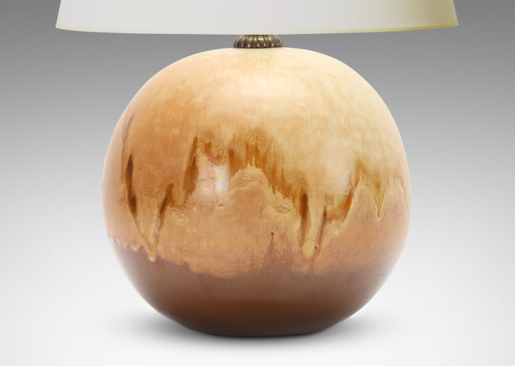 Gallery BAC globe form in stoneware with a flowing gold/acorn over brown glazing