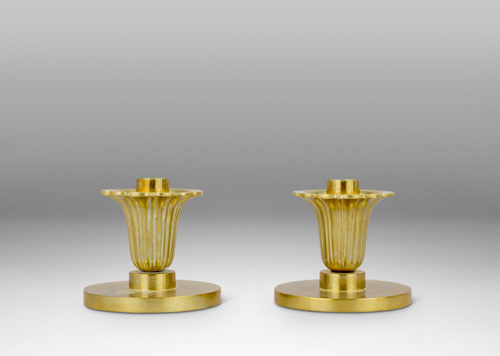 Gallery BAC disk plinths and stylized floral bobeches; brass