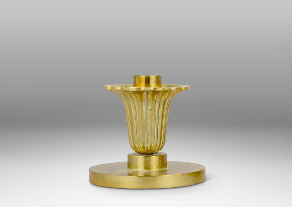 Gallery BAC disk plinths and stylized floral bobeches; brass