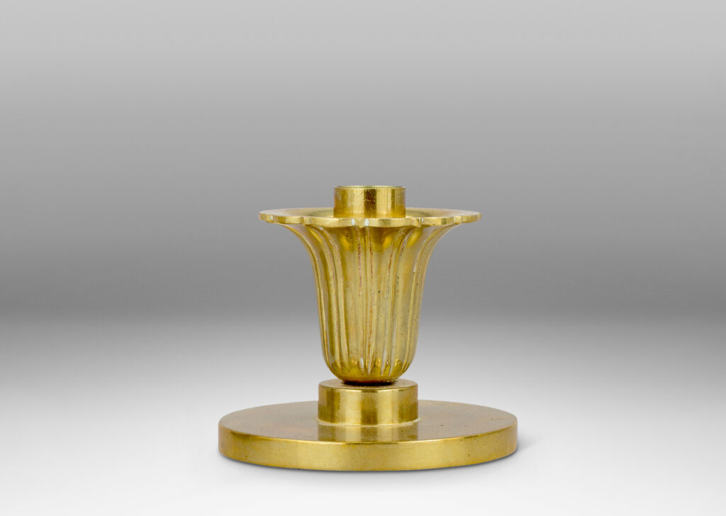 Gallery BAC disk plinths and stylized floral bobeches; brass