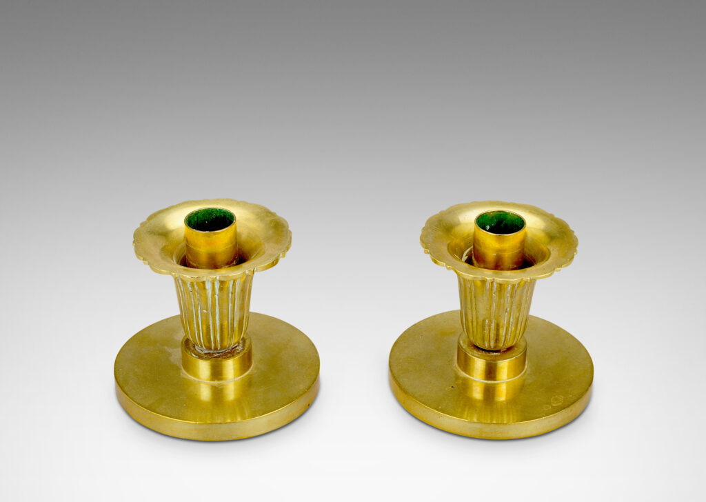 Gallery BAC disk plinths and stylized floral bobeches; brass