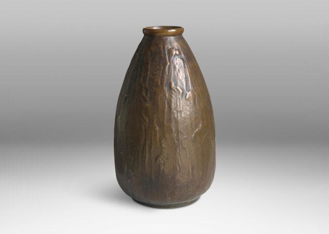 Gallery BAC tapering bud evoking form with a worked organic texture; cast patinated bronze;