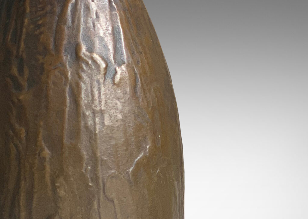 Gallery BAC tapering bud evoking form with a worked organic texture; cast patinated bronze;