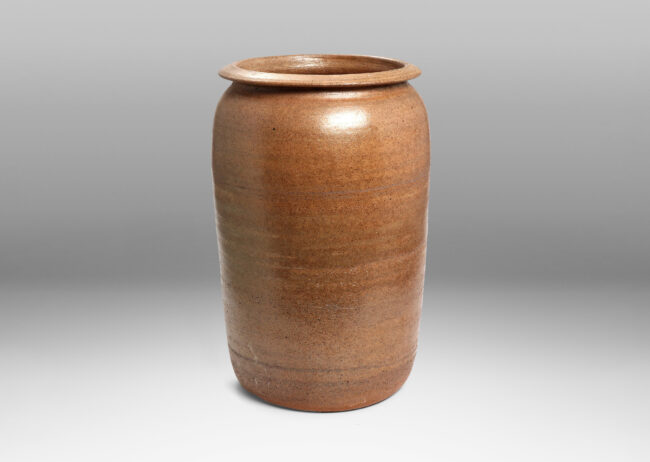 Gallery BAC tapered cylinder form with wide mouth ringed by a sculpted lip, hand-turned russet toned earthenware with a subtly rustic surface texture and thin gray glaze