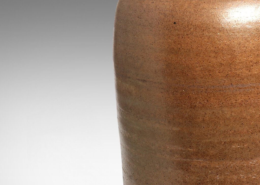 Gallery BAC tapered cylinder form with wide mouth ringed by a sculpted lip, hand-turned russet toned earthenware with a subtly rustic surface texture and thin gray glaze