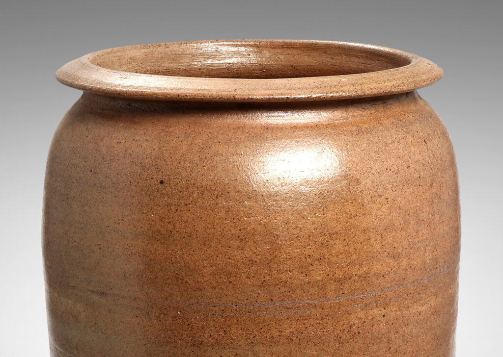 Gallery BAC tapered cylinder form with wide mouth ringed by a sculpted lip, hand-turned russet toned earthenware with a subtly rustic surface texture and thin gray glaze