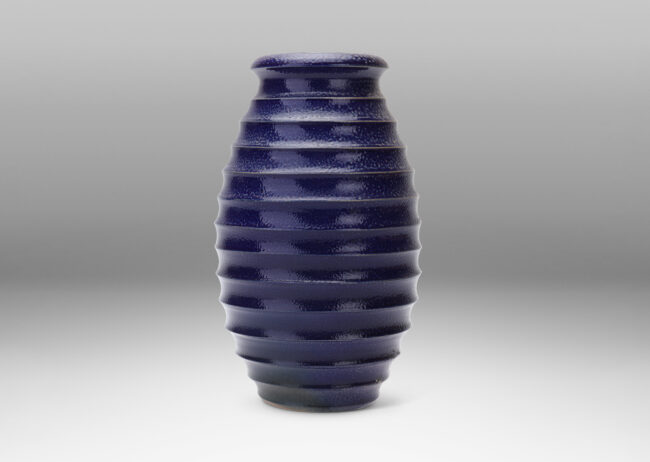 Gallery BAC ovoid form with wide mouth and horizontal fluting, glazed in a rich saturated blue