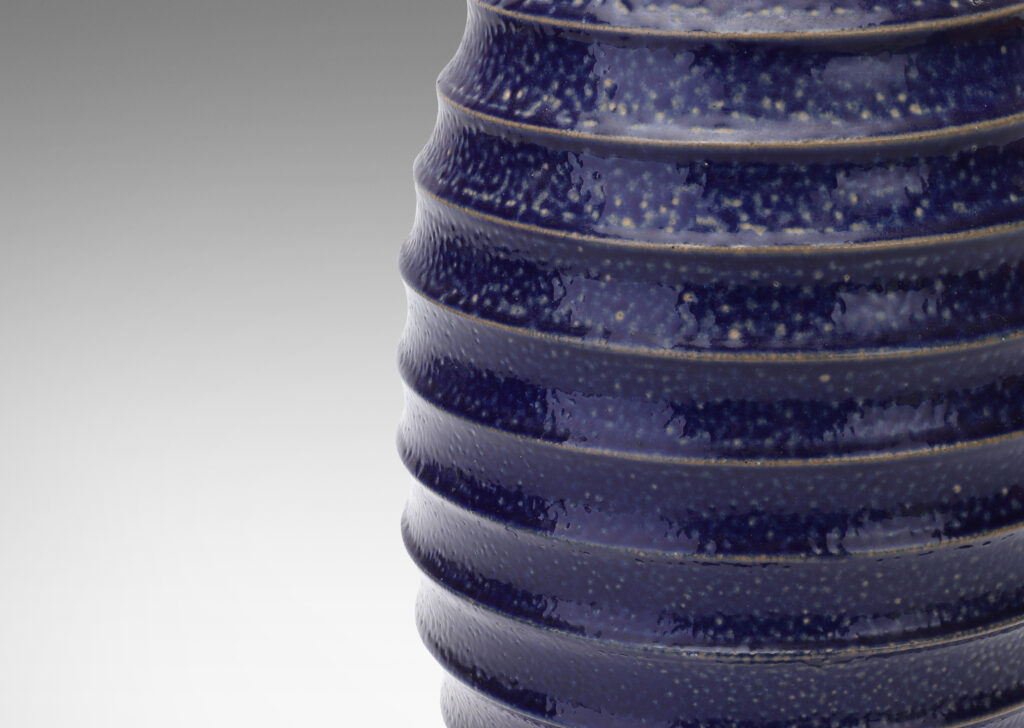 Gallery BAC ovoid form with wide mouth and horizontal fluting, glazed in a rich saturated blue