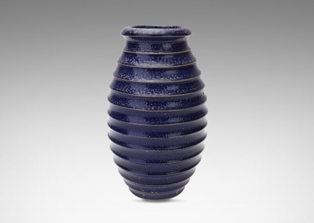 Gallery BAC ovoid form with wide mouth and horizontal fluting, glazed in a rich saturated blue