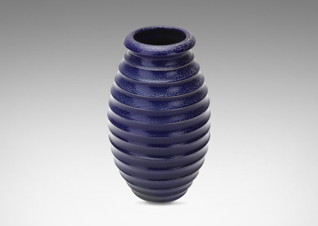 Gallery BAC ovoid form with wide mouth and horizontal fluting, glazed in a rich saturated blue