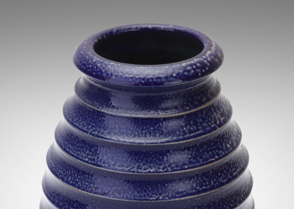 Gallery BAC ovoid form with wide mouth and horizontal fluting, glazed in a rich saturated blue