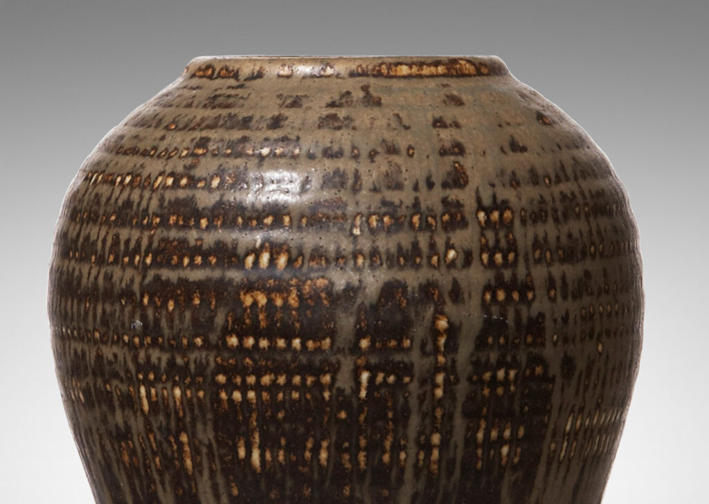 Gallery BAC organic form and stippled pattern around mouth and on shoulders in stoneware with sage green glaze flowing over brown