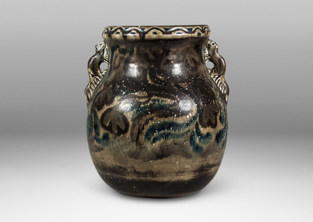 Gallery BAC globe body with wide patterned lip, handles in the form of beavers, and abstracted chestnut trees glazed on both side