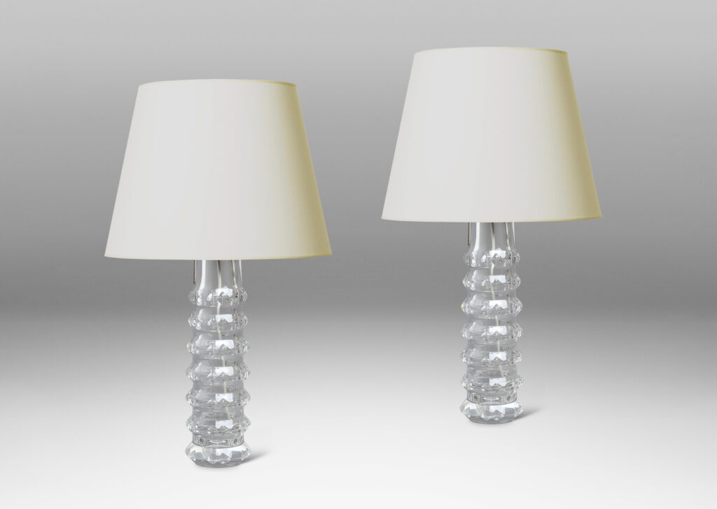 Gallery BAC cylindrical bases punctuated with notched raised bands to catch the light, crafted in cut crystal