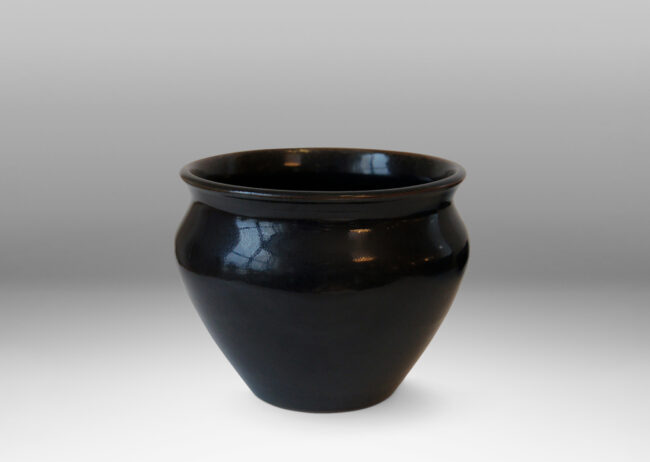 Gallery BAC tapered wide urn form with coved neck, in stoneware glazed in a deep black