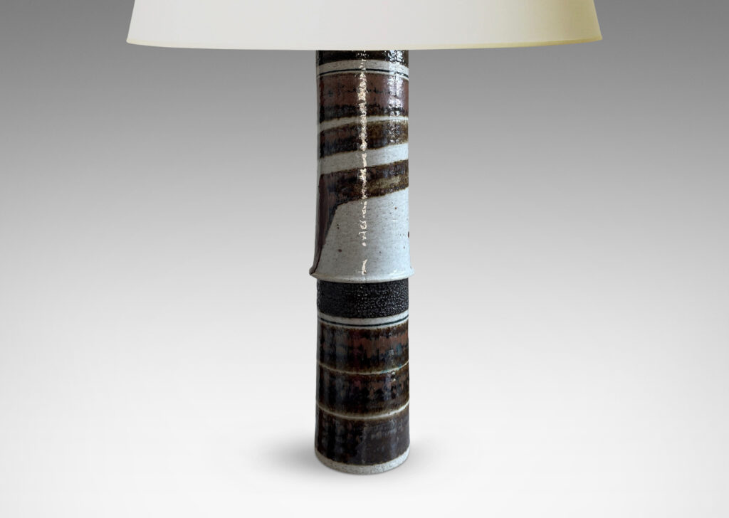 Gallery BAC columns of hand-thrown stoneware glazed with bold graphic stripes in brown and gray and chocolate brown over a pale oyster tone