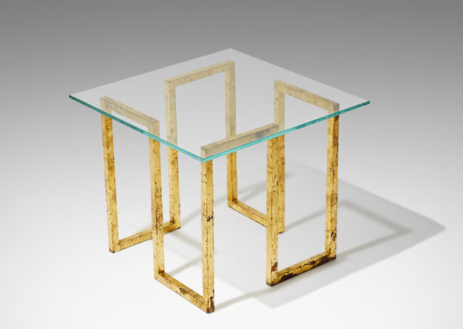 Gallery BAC cube form base comprised of a single line of gilded wrought iron sculpted in a continuous Greek meander style pattern supporting a floating square glass top