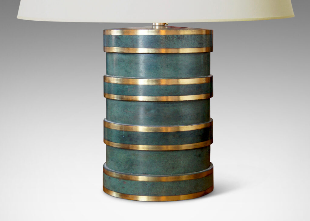 Gallery BAC ylindrical form divided into sections of alternating diameter like a coined column, crafted in bronze