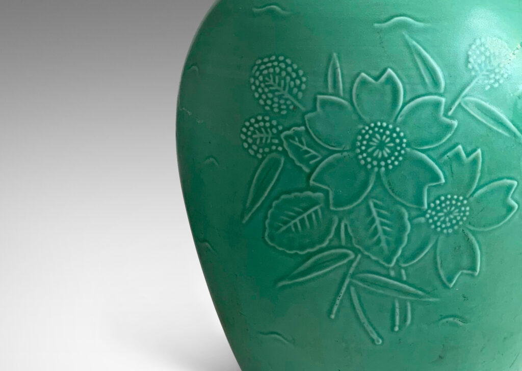 Gallery BAC tapering form with floral reliefs, in stoneware with a celadon/seafoam green glaze