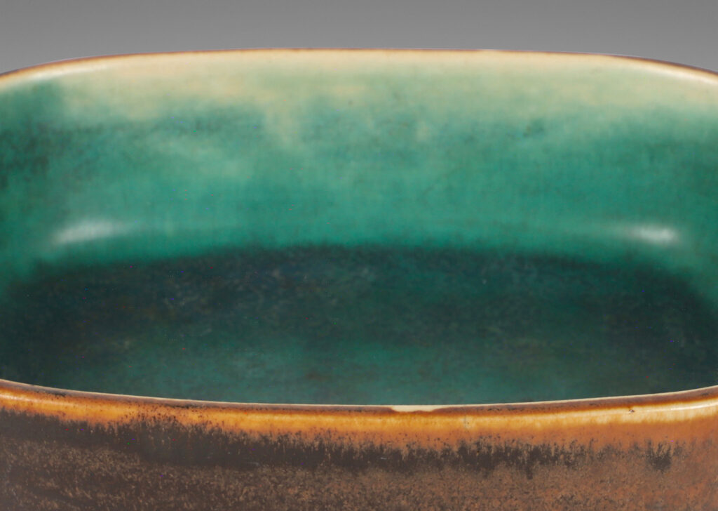 Gallery BAC modeled rectangular form with a delicate harefur brown finish outside and an ethereal green-blue interior