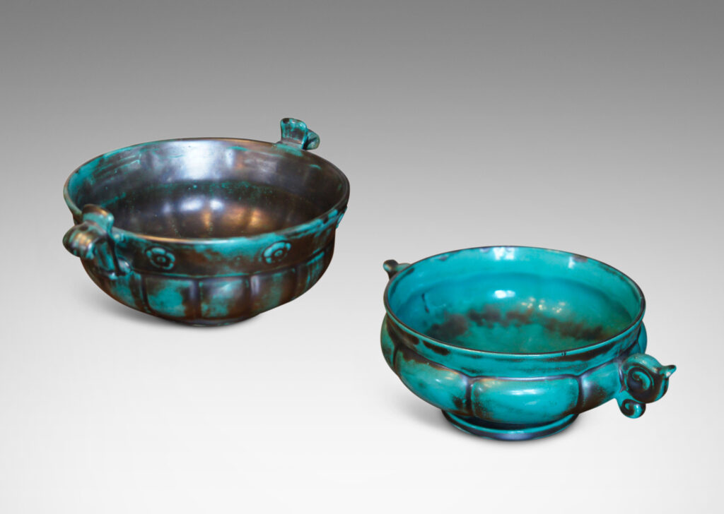 Gallery BAC blend of Viking, Chinese, and Art Deco influences, having wide lobed forms on small plinths and handles, faience with an aqua-green copper glaze