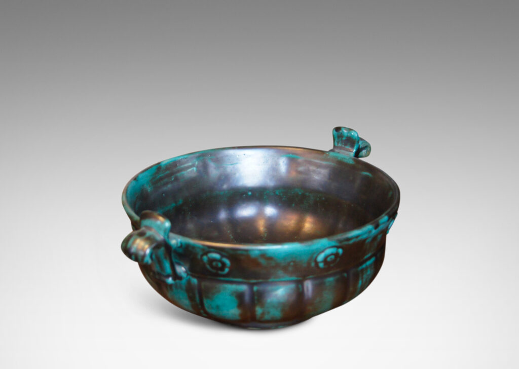 Gallery BAC blend of Viking, Chinese, and Art Deco influences, having wide lobed forms on small plinths and handles, faience with an aqua-green copper glaze