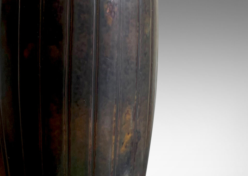 Gallery BAC tapering form with vertical reeding in relief; stoneware with rich mahogany brown toned glazing