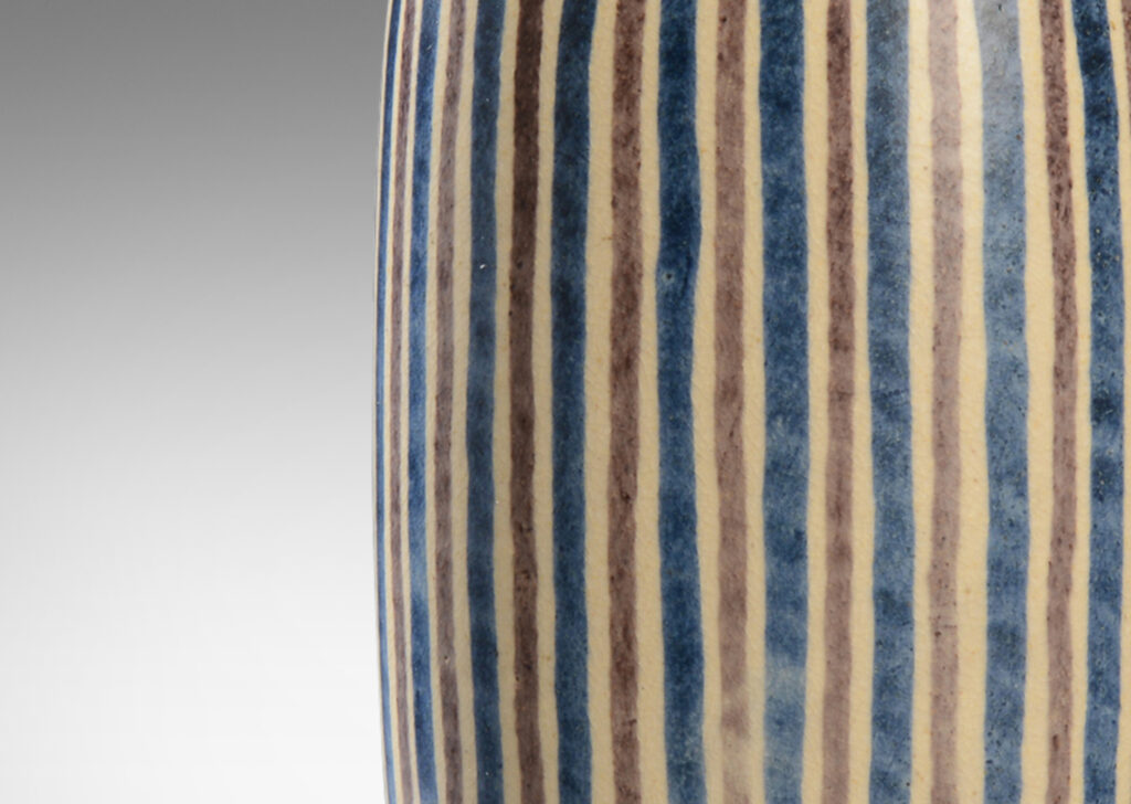 Gallery BAC stoneware glazed in ivory with alternating blue and brown striation