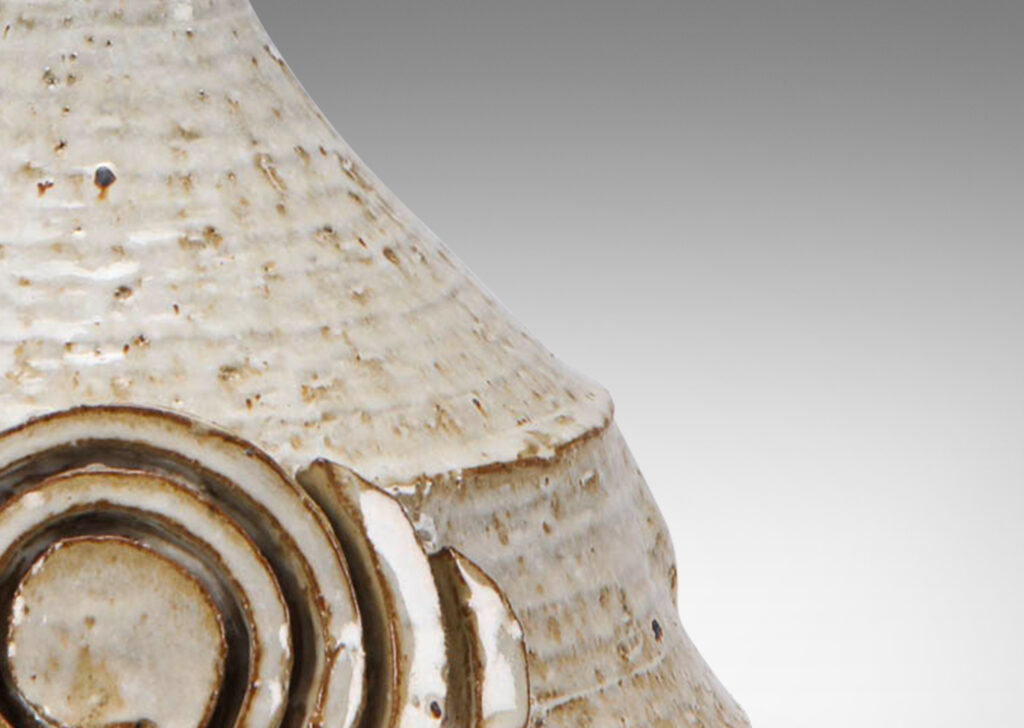 Gallery BAC conical form with applied spiraling motif; hand-turned earthenware with a flowing white glaze