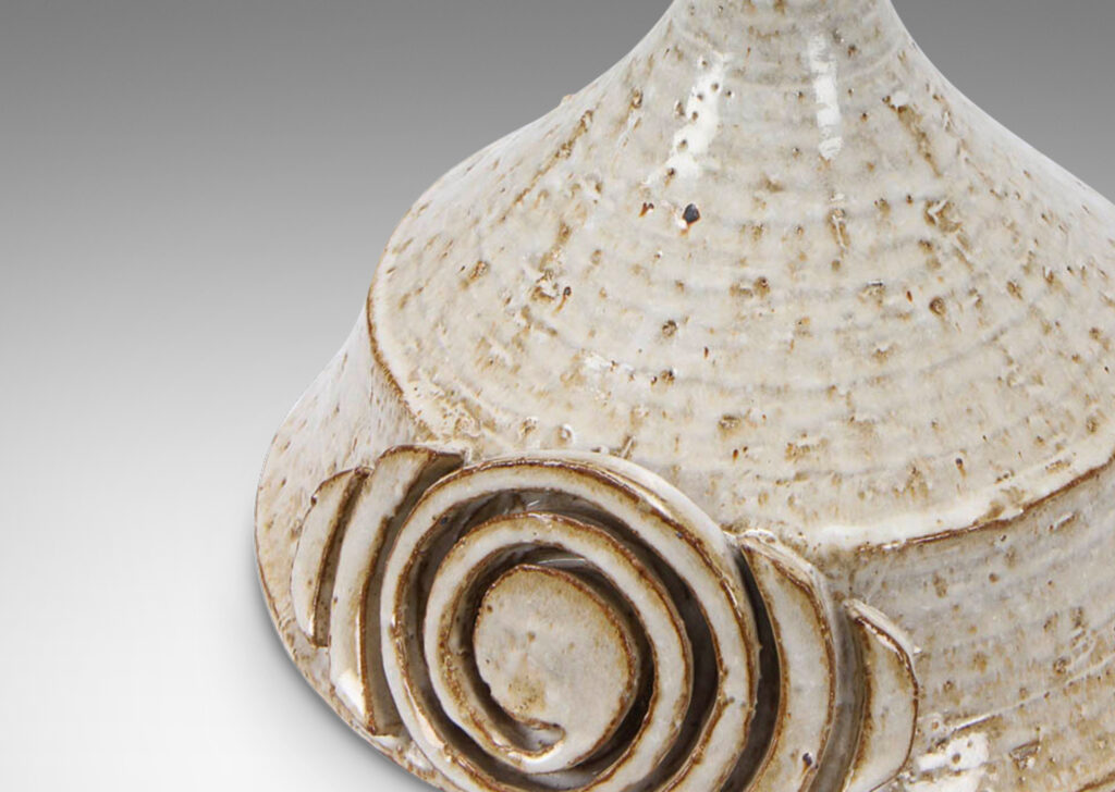 Gallery BAC conical form with applied spiraling motif; hand-turned earthenware with a flowing white glaze