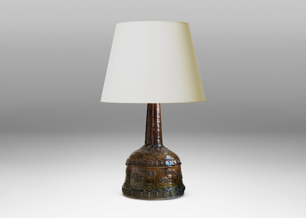 Gallery BAC all base with wide bell form and attenuated neck, richly ornamented with applied and impressed motifs