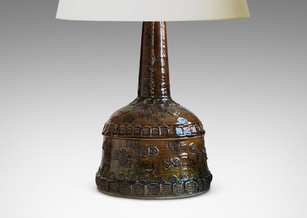 Gallery BAC all base with wide bell form and attenuated neck, richly ornamented with applied and impressed motifs