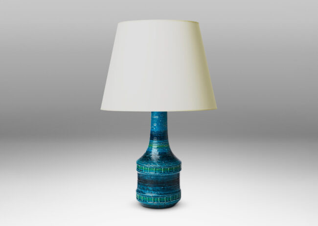 Gallery BAC bottle form with tall neck and impressed bands of squares in a saturated azure glaze