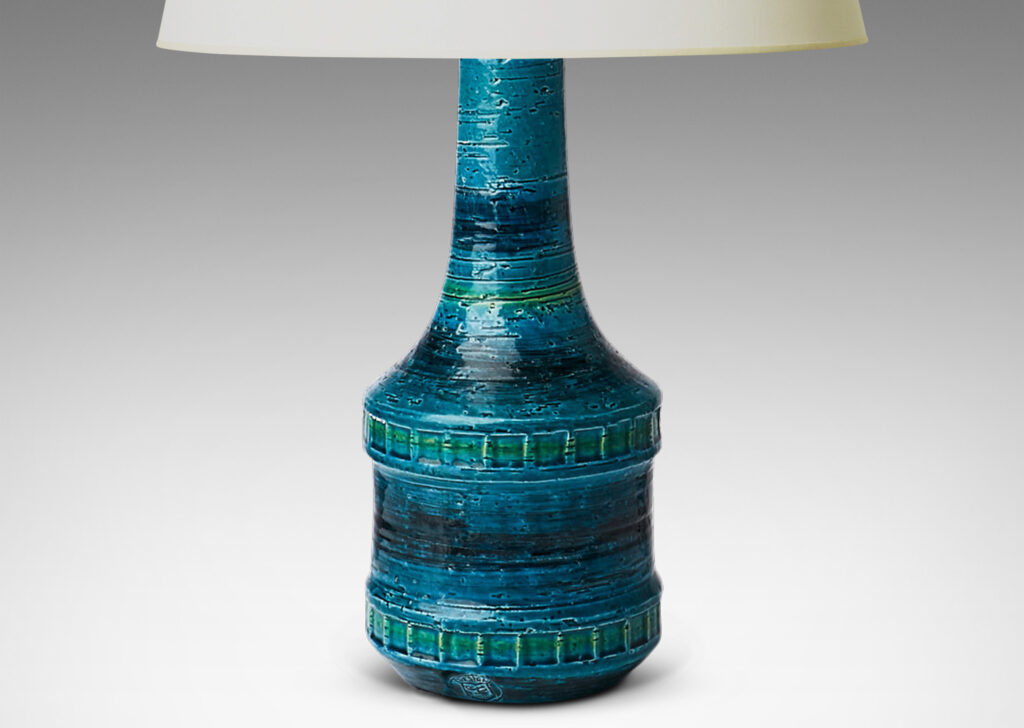 Gallery BAC bottle form with tall neck and impressed bands of squares in a saturated azure glaze