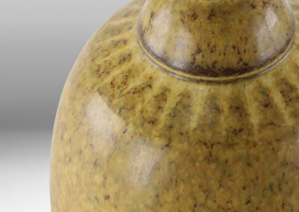 Gallery BAC ovoid form with radiating detail at neck and mottled sandy tan glaze