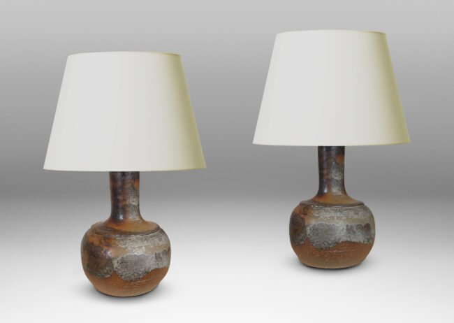 Gallery BAC low rounded forms and tall necks with a grog textured finish, partially glazed with petal-like strokes of gray-brown glaze