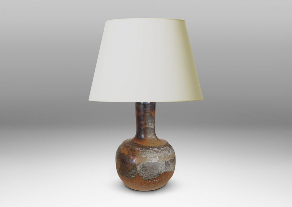 Gallery BAC low rounded forms and tall necks with a grog textured finish, partially glazed with petal-like strokes of gray-brown glaze