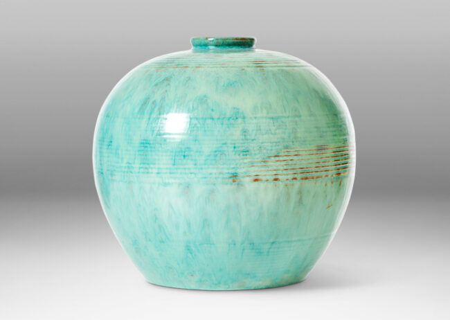 Gallery BAC wide globe form with bands of relief ridges in a flowing turquoise glaze