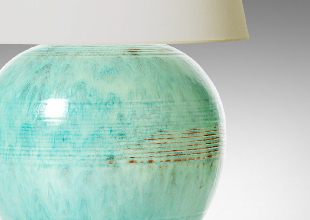 Gallery BAC wide globe form with bands of relief ridges and a flowing pale turquoise