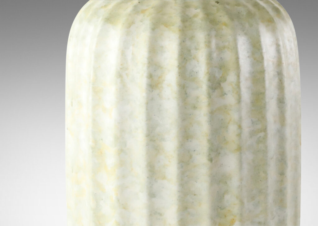 Gallery BAC straight-sided ovoid form with vertical fluting in a sponged pale green-cream glaze