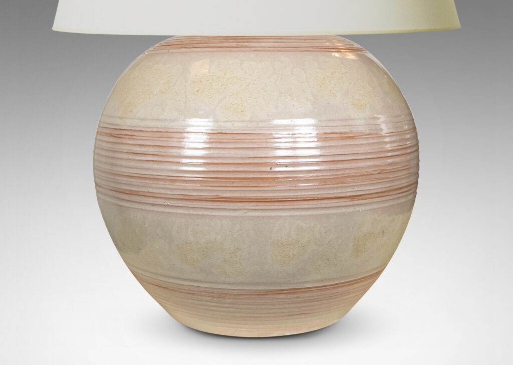 Gallery BAC plump globe form with ridged banding glazed in pale gray-tan with hints of terra cotta