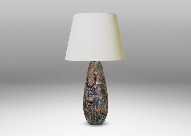 Gallery BAC tall ovoid form with carved depiction of a stag and deer with multicolor glaze