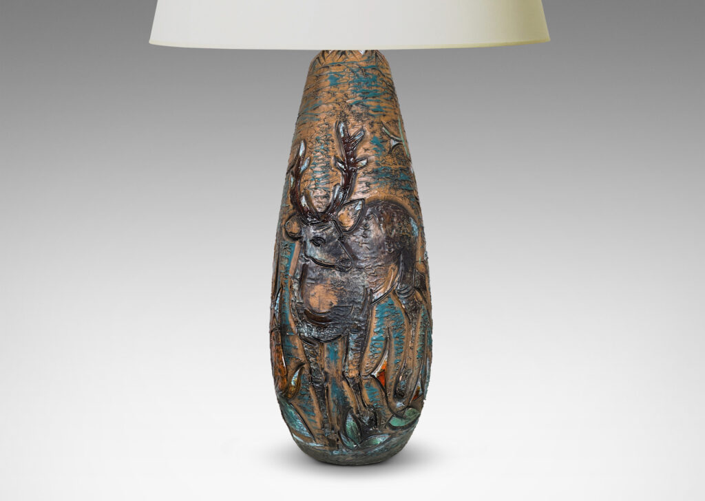 Gallery BAC tall ovoid form with carved depiction of a stag and deer with multicolor glaze