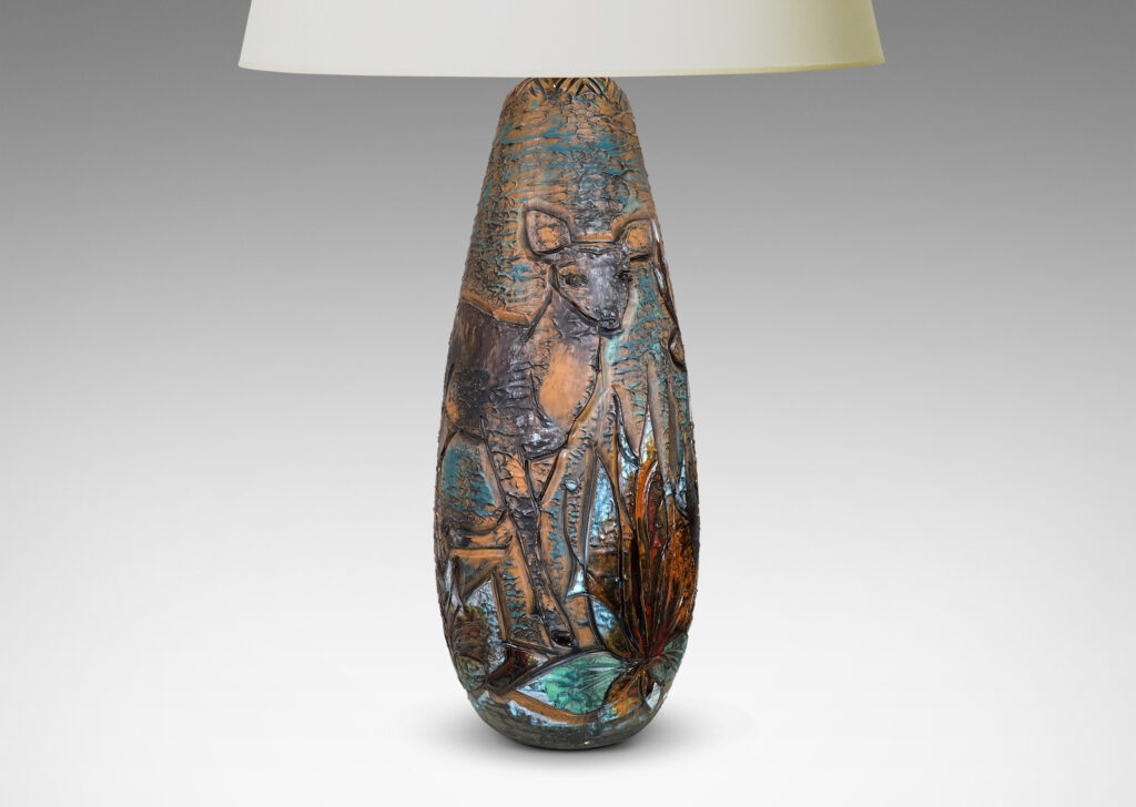 Gallery BAC tall ovoid form with carved depiction of a stag and deer with multicolor glaze