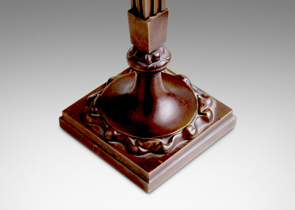 Galery BAC compact flame surmounted by a suspended square block, with square tapered torch balanced on a flame rosette above a round platform surrounded by flame modeling sitting on a square base